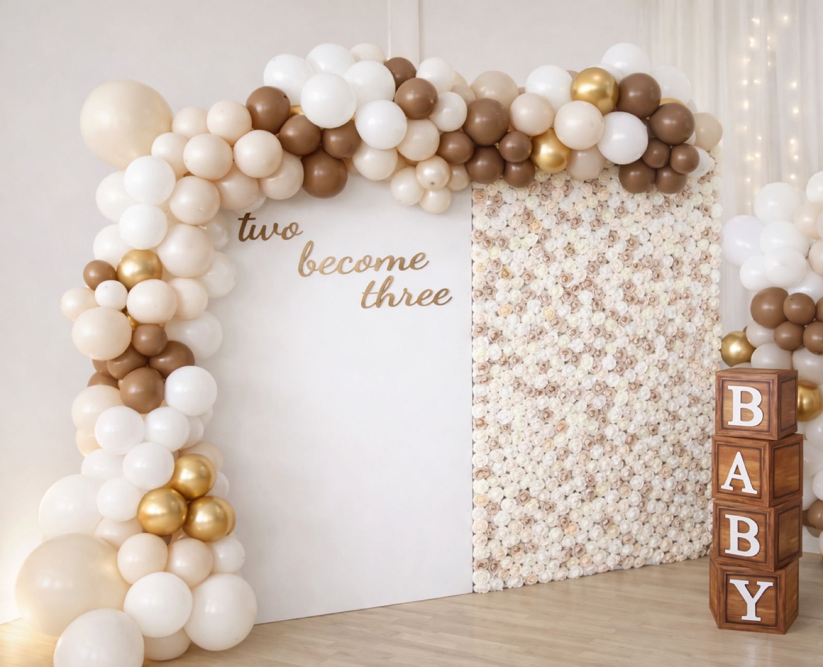 Neutral balloon installation, floral wall and baby blocks